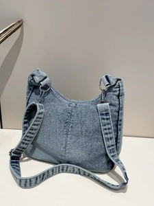 Retro light blue denim hobo shoulder bag with silver hardware and adjustable strap