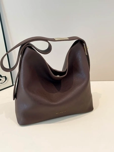 Deep brown minimalist faux leather tote bag with wide shoulder strap and gold metal buckle