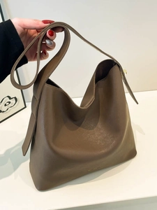 Brown leather Hobo bucket bag with large capacity and minimalist shoulder strap design