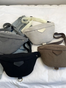 Collection of corduroy belt bags in cream, grey, black and brown for a casual autumn look