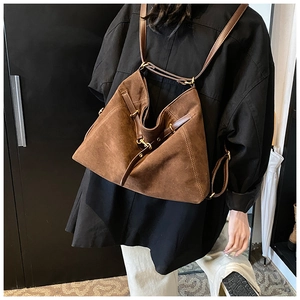 Detailed view of the brown vintage versatile tote bag with adjustable leather shoulder straps