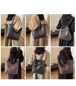 Detail view of large vintage tote backpack with multi-way straps and frosted leather texture