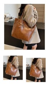 Close-up of vintage brown tote bag featuring metallic buckles and premium faux leather finish
