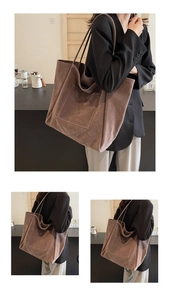 Detailed view of brown suede tote bag with front pocket for casual autumn style