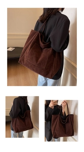 Macro detail of brown suede tote bag with large front pocket for daily commute use