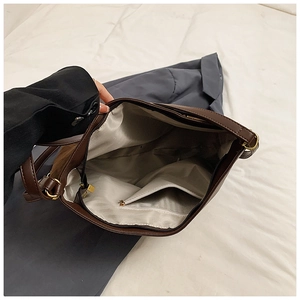 Detail view of large tote bag interior with fabric lining and internal zipper pocket