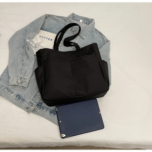 Grand sac fourre-tout noir en toile avec poches avant et espace pour tablette tactile