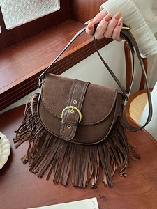 Vintage brown suede saddle bag with long tassels and gold buckle for women