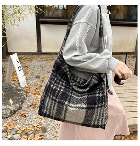 Plaid oversized shoulder tote bag with soft texture and wide straps for winter outfits