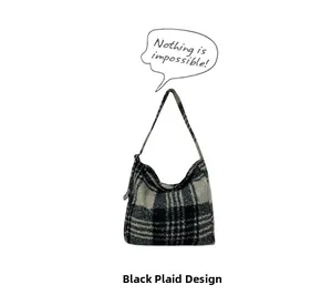 Detailed close-up of a black plaid wool fabric tote bag with a soft winter texture