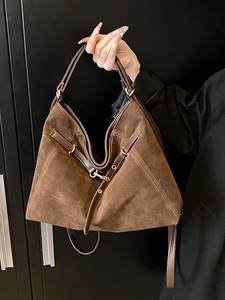 Retro dark brown matte leather tote backpack with large capacity and gold buckle accents