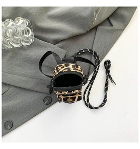 Mini leopard print crossbody bag with woven strap and black zipper detail for kids