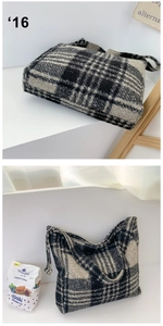 Detail showing the thick textured fabric and black and white checkered pattern of the tote bag