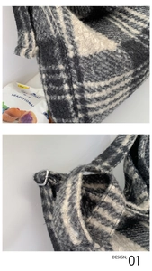 Detail of black and white checkered plush tote bag with silver metal adjustment buckle