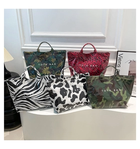 Detailed display of tote bags in leopard, zebra, and floral prints with waterproof texture