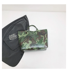 Detail view of the glossy camouflage tote bag with large capacity and double handles