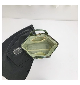 Top view of large tote bag interior with green lining, zipper pocket, and inner slot