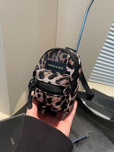 Mini leopard print crossbody bag for girls featuring a trendy micro backpack design