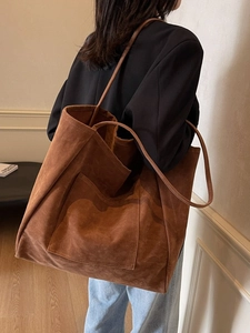 Brown suede minimalist large tote bag with shoulder straps and front pocket detail