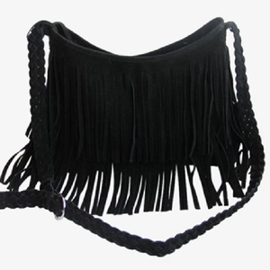Retro black matte crossbody bag with long tassels and woven shoulder strap on white backdrop