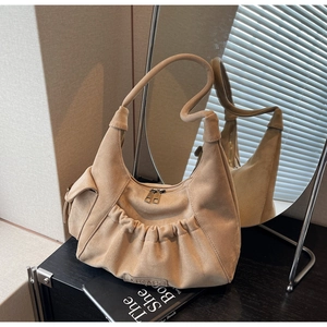 Detail of light khaki suede crescent bag with pleated design and side flap pocket