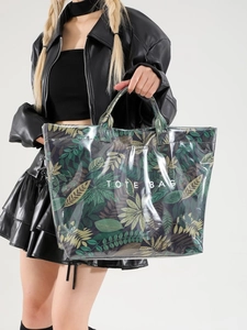 Large waterproof tote bag with green plant leaf patterns and double top handles