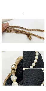 Detail showing high-density black glitter fabric, gold chain, and pearl accents on the bag