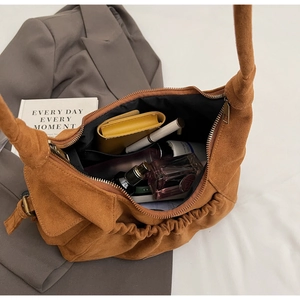 Detailed interior of brown suede tote bag showing large capacity for daily essentials