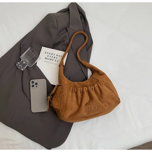 Brown suede tote bag with pleated design, MKMX tag, and attached mini coin purse detail