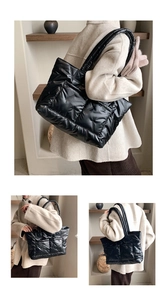 Close-up of black quilted puffer tote bag with soft satin finish and padded handles