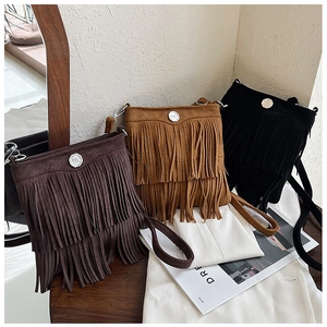 Three bohemian crossbody bags with double fringe tassels in brown, tan, and black
