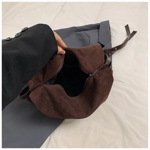 Detailed view of dark brown PU leather tote bag with interior zipper and black lining