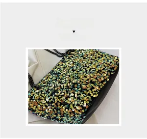 Detailed close-up of vibrant gradient sequins and a black metal chain on the shoulder bag