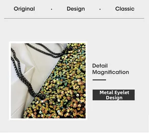 Detail of shimmering gold sequins and gunmetal square chain strap on a stylish bag