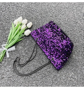 Detailed view of shimmering purple sequin bag with a stylish silver chain strap