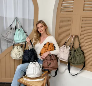 Detailed view of colorful nylon drawstring bucket bags with adjustable wide straps
