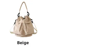 Detail of beige nylon bucket bag featuring drawstring closure and thick carrying handle