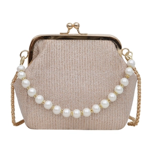 Elegant champagne metal frame clutch bag with faux pearl handle and gold chain strap