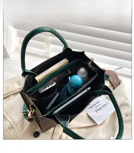 Top view of spacious handbag interior showing multiple pockets and compartments