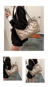 Detail of champagne gold quilted tote bag with woven shoulder strap and glossy finish