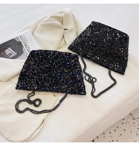 Close-up of sparkling sequin crossbody bags in black and iridescent with chain straps
