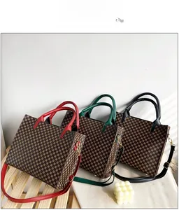 Detailed view of three vintage tote bags in red, green, and black with geometric patterns