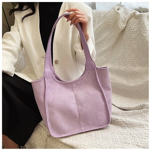 Close-up of lavender purple plush tote bag with detailed vertical stitching and soft texture
