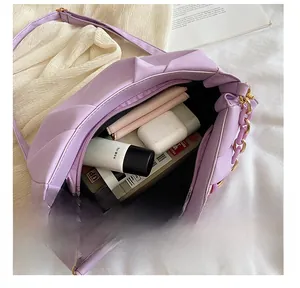 Top view of lavender pleated cloud bag showing interior storage capacity and chain strap