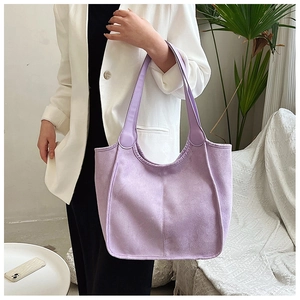 Detail of lavender tote bag with visible stitching and smooth matte finish on shoulder strap