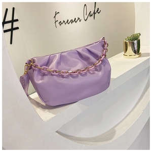 Detail view of lilac ruched cloud bag with stylish chunky gold and purple chain strap