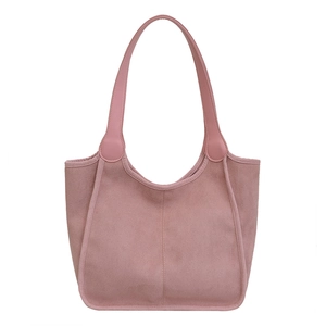 Pink plush tote bag with long handles and a minimalist suede texture for women
