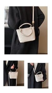 Detailed views of creamy white vertical pleated bucket bag with metallic gold hardware