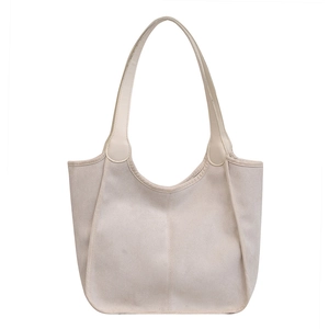 Minimalist beige plush tote bag for women featuring a spacious hobo design and slim shoulder straps