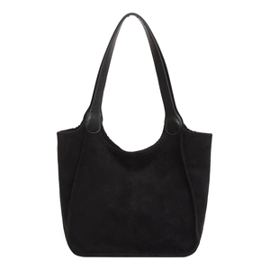 Black plush suede tote bag with leather straps and elegant curved stitching detail